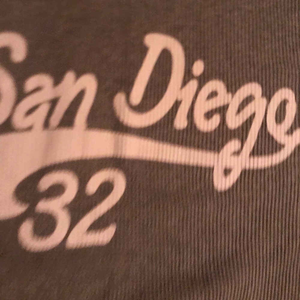 A thermal material, crew neck, long sleeve, with “San Diego 32” on the jersey.